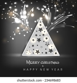 Shiny X-mas Tree in triangle shape on fireworks decorated background for Merry Christmas and Happy New Year celebrations..