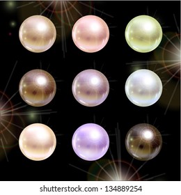 Shinyl pearls on black background. Vector set.