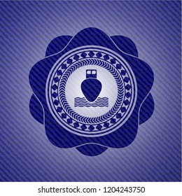 ship icon inside badge with denim texture