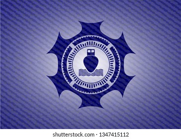 ship icon inside badge with denim background