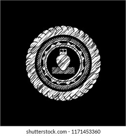 ship icon inside chalkboard emblem written on a blackboard