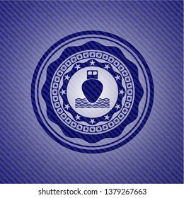 ship icon inside emblem with denim high quality background