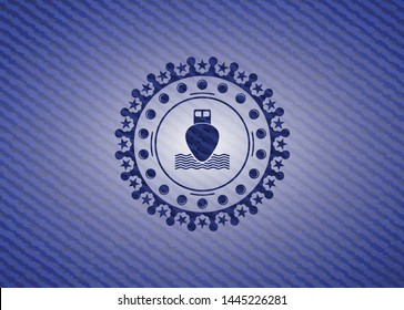 ship icon inside emblem with denim texture