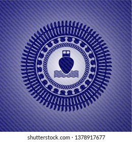 ship icon inside emblem with jean background