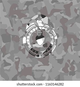 ship icon inside grey camouflage emblem