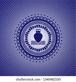 ship icon inside jean or denim emblem or badge background