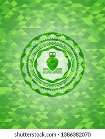 ship icon inside realistic green mosaic emblem