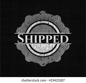 Shipped chalk emblem written on a blackboard