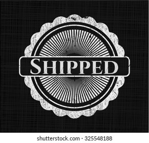 Shipped chalkboard emblem on black board