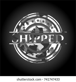 Shipped on grey camo pattern