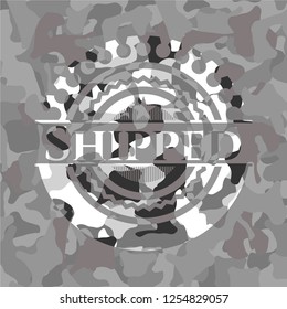 Shipped on grey camouflaged texture