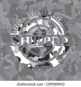 Shipped on grey camouflaged texture