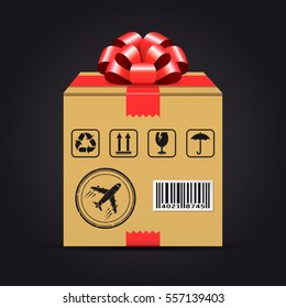 Shipping cardboard box with red bow. Gift delivery concept.