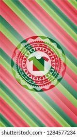 shirt icon inside christmas colors style badge.