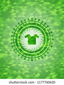 shirt icon inside green emblem with mosaic ecological style background