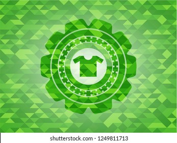 shirt icon inside green emblem. Mosaic background