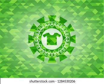 shirt icon inside green emblem with triangle mosaic background