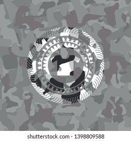 shirt icon inside grey camouflaged emblem