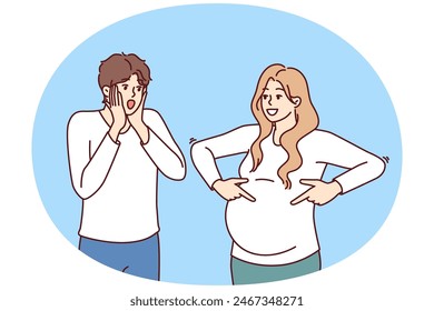 Shocked man is surprised to see pregnant woman and does not want to become father or take girl as wife. Pregnant lady pointing fingers at belly for concept of using contraceptives.