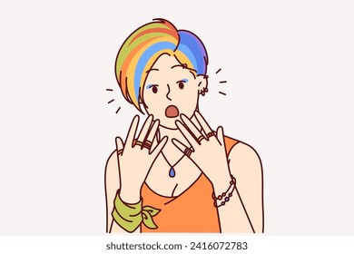 Shocked woman with colorful hairstyle surprised by own appearance after getting help from stylist. Shocked girl with fashion accessories opens mouth with delight after receiving amazing business offer