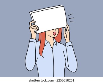 Shocked woman office worker covers eyes with paper after seeing serious mistake. Shocked girl in shirt is frightened by opening mouth checking documents received from manager