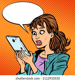 Shocked woman reading a smartphone. Comic cartoon pop art retro vector illustration drawing