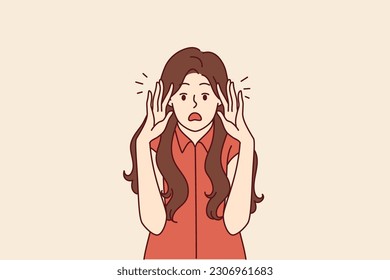 Shocked woman screams and looks at screen bringing palms to face after hearing frightening news. Shocked girl opens mouth wide and starts to worry about getting fired or high taxes