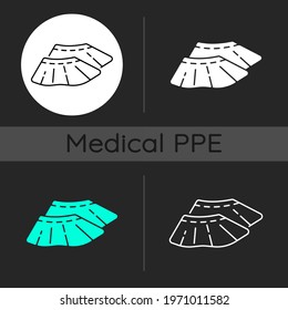 Shoe covers dark theme icons set. Sterile footwear. Protective wear from contamination. Disposable PPE. Linear white, solid glyph and RGB color styles. Isolated vector illustrations