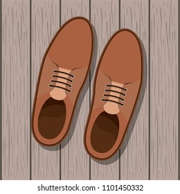 shoe masculine over wooden background