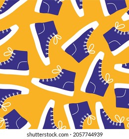 Shoe pair, boots, footwear. Canvas shoes. Сolor seamless pattern on yellow background. Doodle. Fashion old style high-top and low-top sneakers. Lace-up shoes. Color flat vector illustration. Isolated.