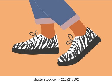 Shoe pair, boots, footwear. Sneakers  shoes. Legs in sneakers with with zebra print and jeans. Fashion glamour style low-top sneakers. Lace-up shoes. Walking. Color Isolated flat vector illustration.