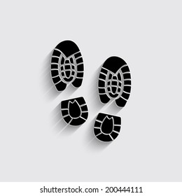 Shoe print icon on a grey background