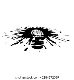 Shoe print in a puddle of mud