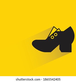 shoe with shadow on yellow background