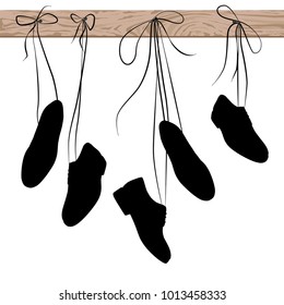 shoes hanging on laces