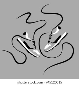 shoes with laces on a gray background