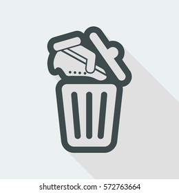 Shoes on trash bin