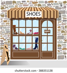 Shoes shop. Building facade of stone. Shoes and boots in the shop window.Vector illustration eps 10.