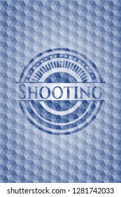 Shooting blue emblem or badge with geometric pattern background.