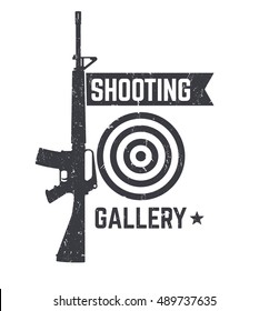 Shooting Gallery logo, sign with automatic rifle over white, texture can be removed