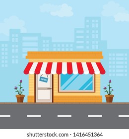 Shop in the front style is located along the road amidst the vast capital city.