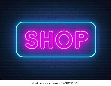 Shop neon sign on brick wall background.