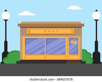 Shop store building icon with front door , window and street lamps flat design