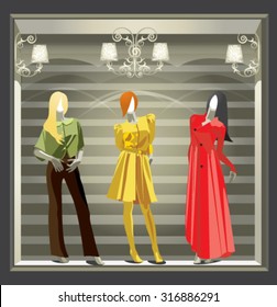 Shop window with mannequins in bright coats