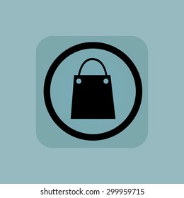 Shopping bag in circle, in square, on pale blue background