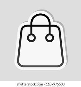 Shopping bag icon. Linear, thin outline. Sticker style with white border and simple shadow on gray background