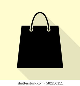 Shopping bag illustration. Black icon with flat style shadow path on cream background.