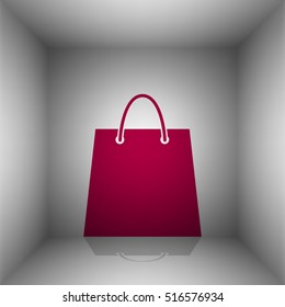 Shopping bag illustration. Bordo icon with shadow in the room.