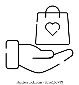 Shopping bag on hand, icon of product offer