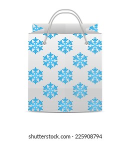 Shopping bag with a pattern of snowflakes isolated on a white background